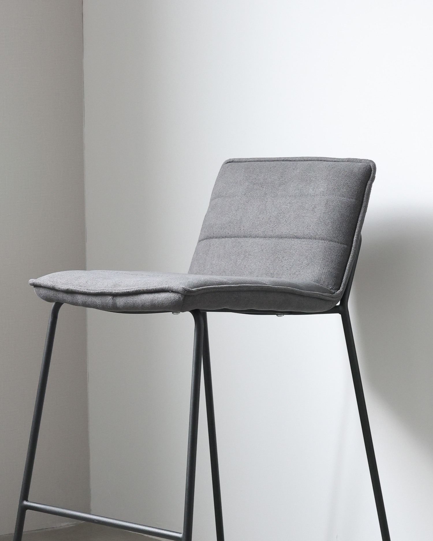 Upholstered grey barstool Upholstered grey barstool