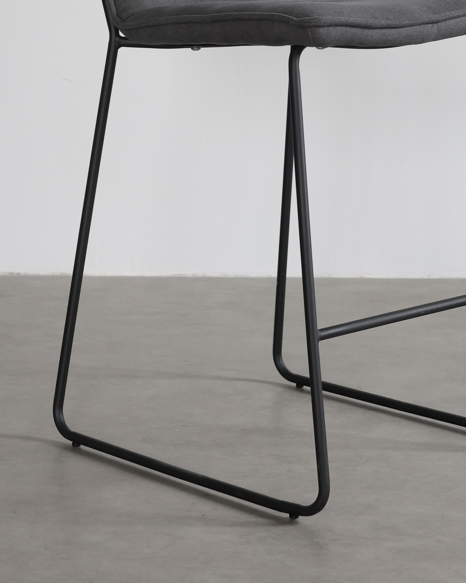 Upholstered grey barstool Upholstered grey barstool